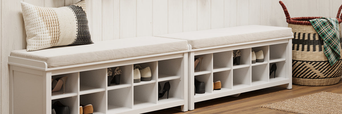 two shoe storage benches placed next to each other filled with shoes and boots in a mudroom