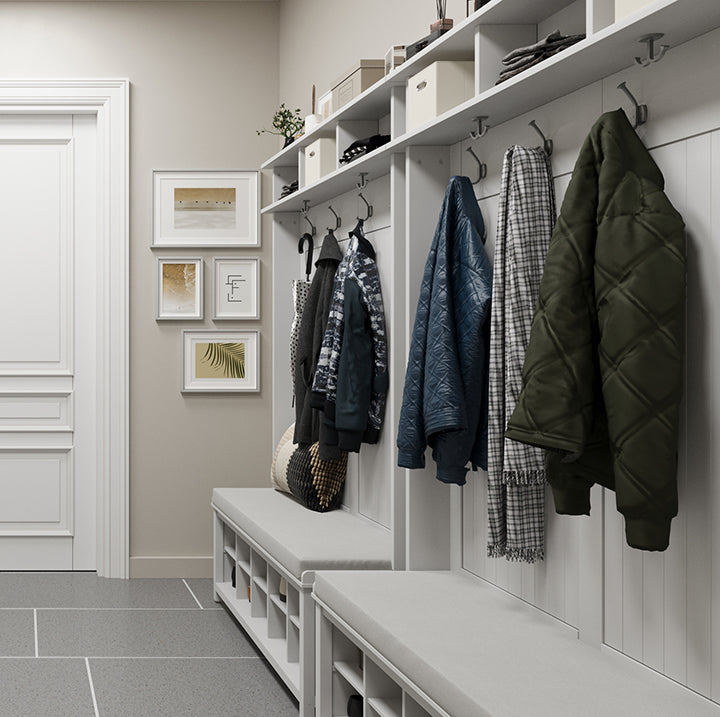 two white John Louis Home hall trees organizing winter coats, hats and gloves in a mudroom